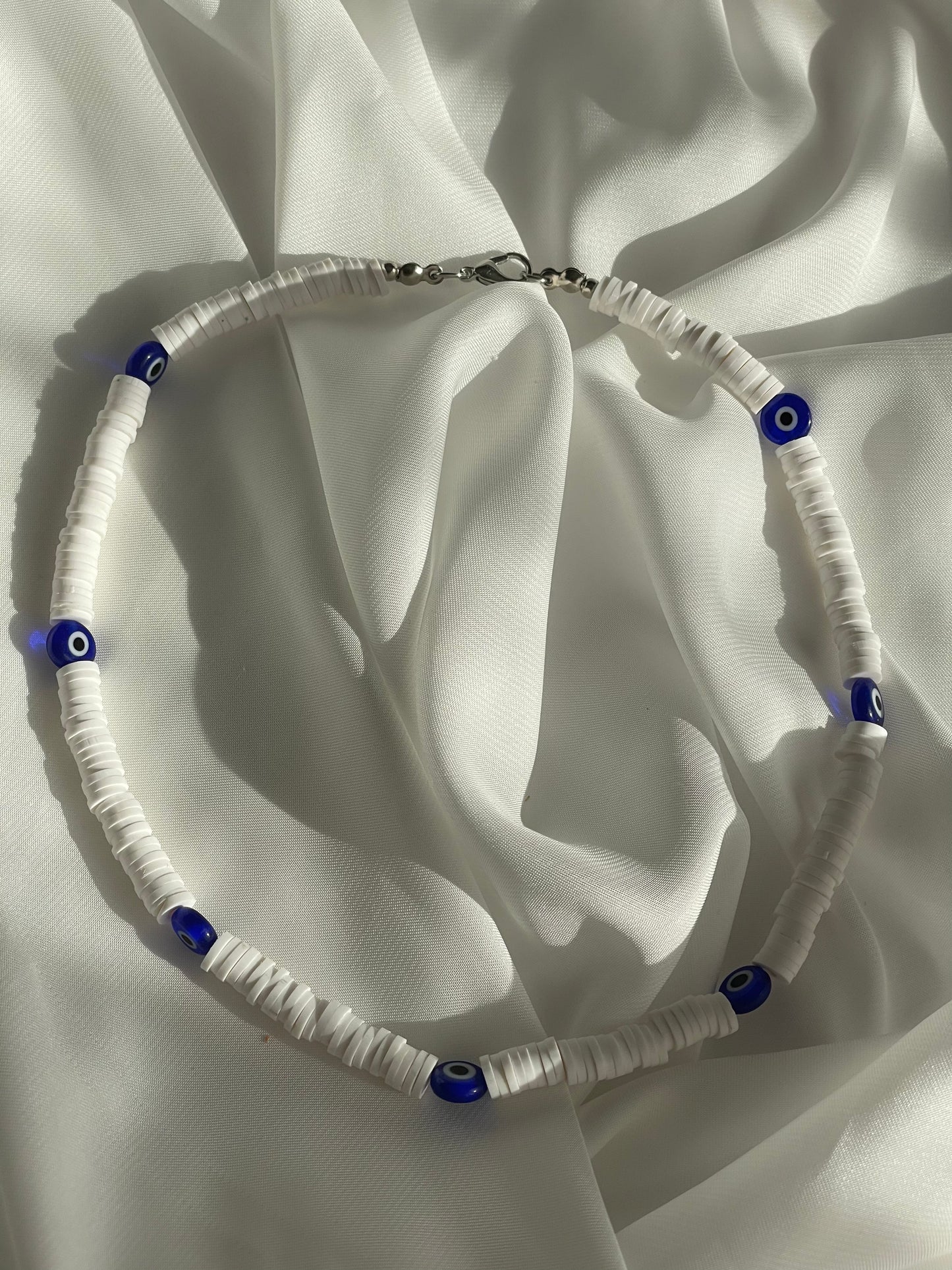 Evil eye x rubber disc beads