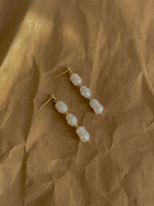 Three pearl drop earrings